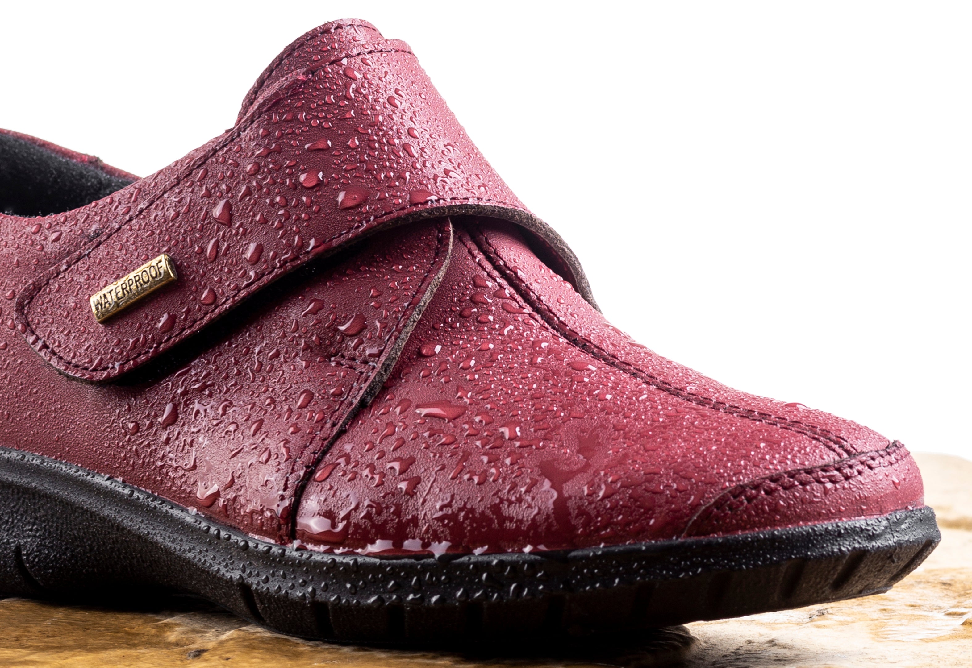 Cotswold Cranham footwear covered in water