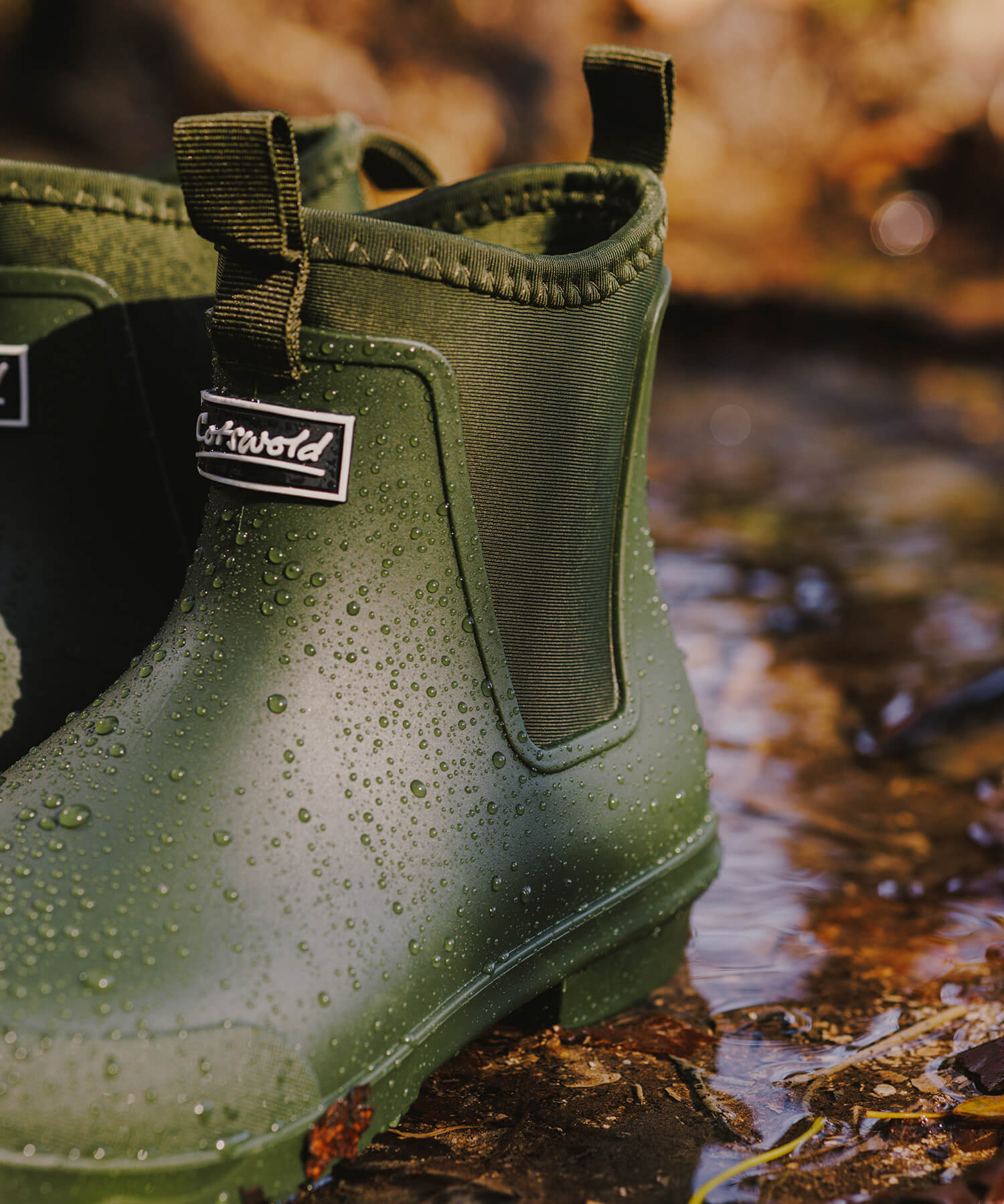 A pair of wet green Cotswold Grosvenor wellies