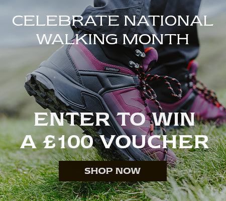 Close up image of a person wearing a pair of burgundy Cotswold Horton Hiking Boots. Text reads 'NATIONAL WALKING MONTH. WIN A £100 VOUCHER. ENTER NOW'