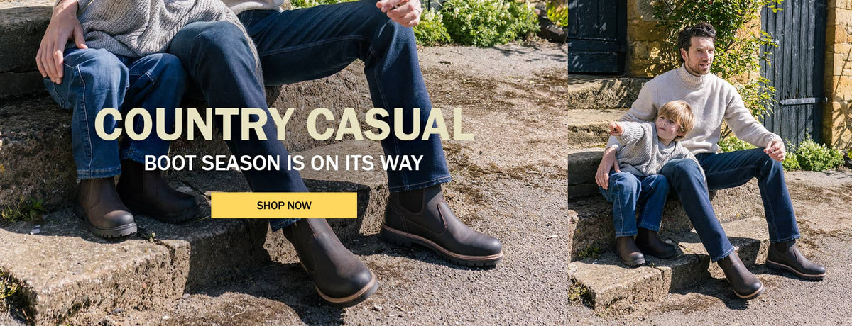 Adult and child wearing brown Cotswold Leafield Boots, with banner text “COUNTRY CASUAL” and “BOOT SEASON IS ON ITS WAY,” plus a “SHOP NOW” button. Click to shop now.
